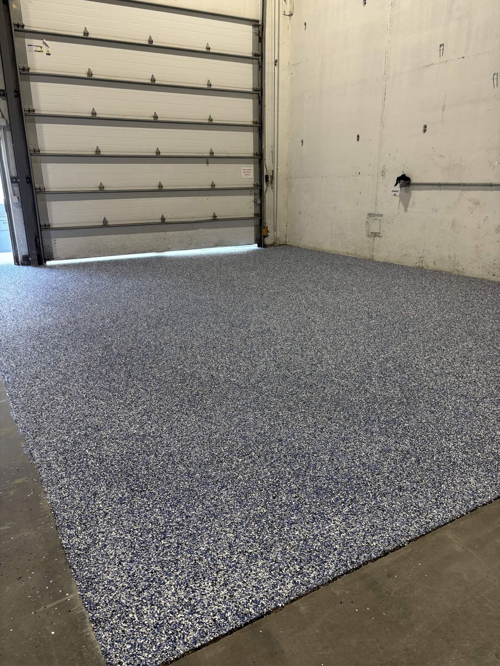 After: commercial flake epoxy warehouse floor