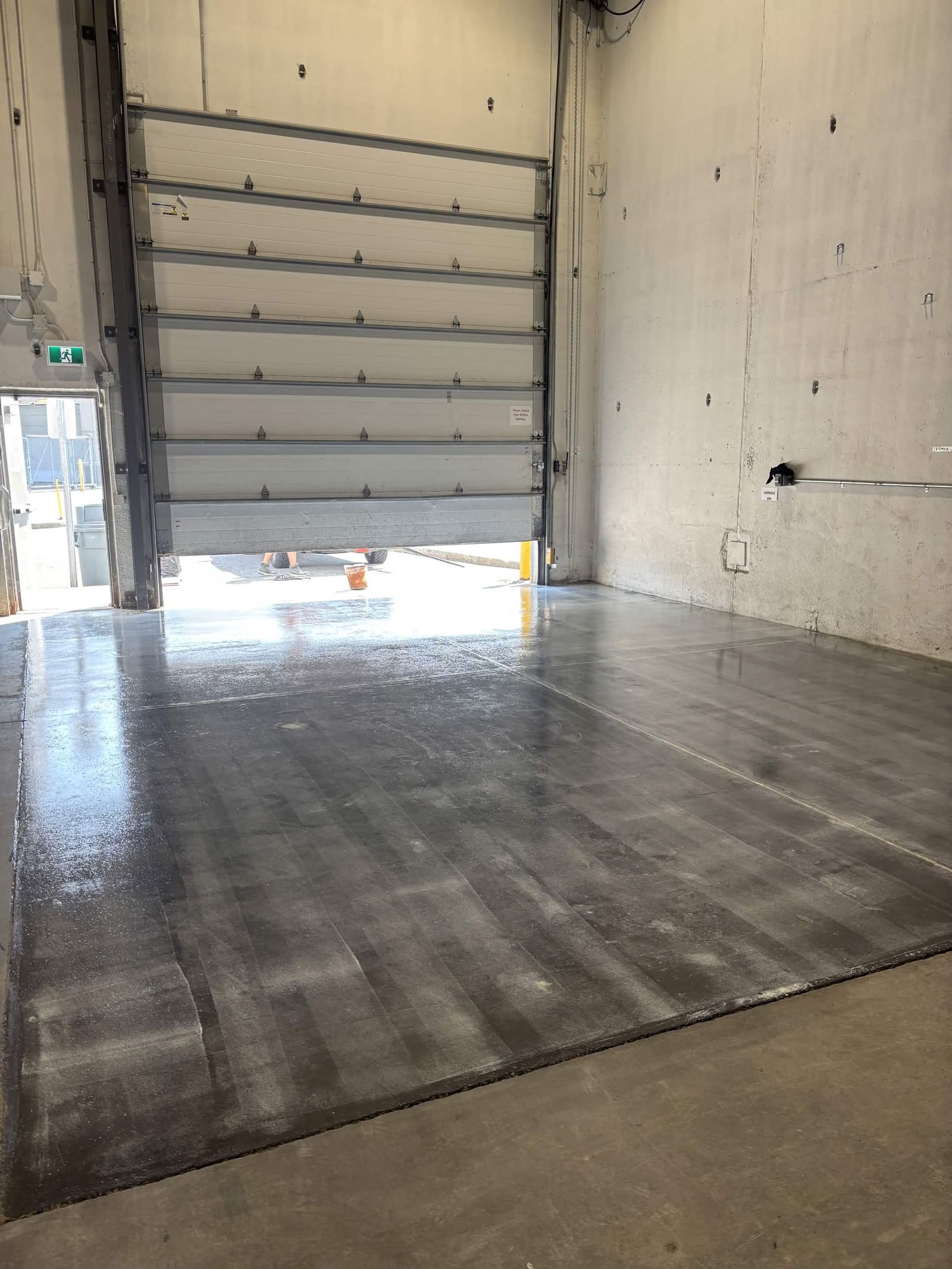 Before: bare commercial warehouse concrete floor